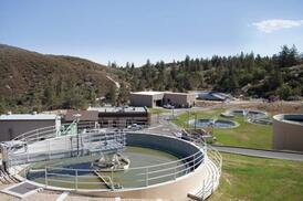 Wastewater treatment plant with large clarifiers