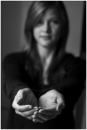 Black and white photo of women cupping her hands together