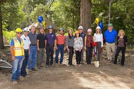 Groundbreaking ceremony with 13 people in the photo